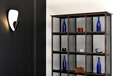 a shelf filled with blue vases in a room at La Suite Gordes in Gordes