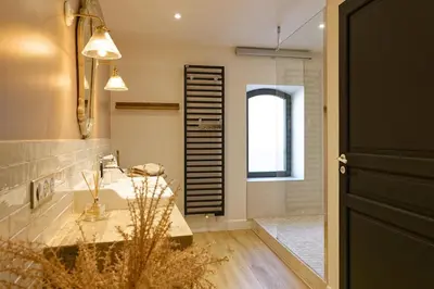 a bathroom with a sink and a mirror at Maison Paulette in Eygalières