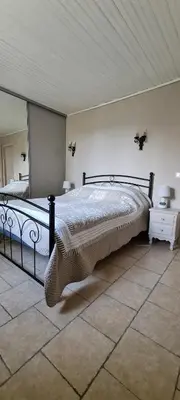 a bedroom with a large bed in a room at Villa Trempadou in Gordes