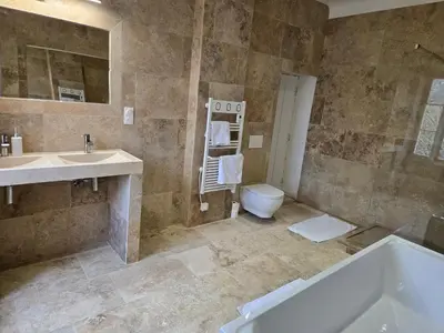 a bathroom with a shower and a toilet in it at Bastide Hedone en Luberon in Apt