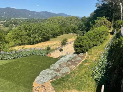 an aerial view of a garden with a stone wall at L'Irisciabella in Lourmarin