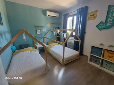 a childs room with two bunk beds in it at Villa moderne avec piscine in Monteux