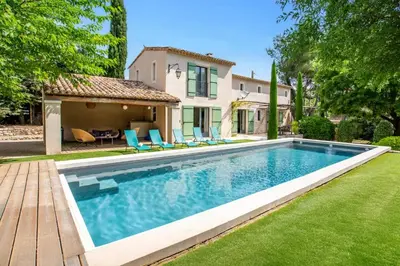 a swimming pool in the yard of a house at Villa Les Alpilles by Villa Plus in Mouriès