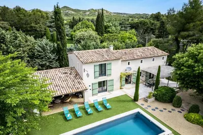 an aerial view of a house with a swimming pool at Villa Les Alpilles by Villa Plus in Mouriès
