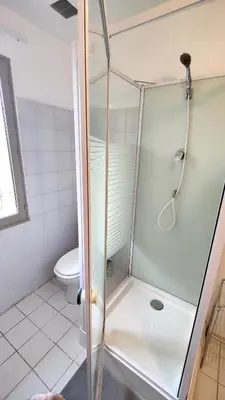 a shower stall in a bathroom with a toilet at Maison provençale au milieu des champs in Robion en Luberon