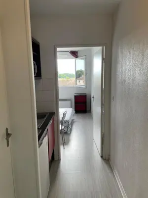 a kitchen with a door leading to a room at Joli appartement sur Aix-en-Provence in Aix-en-Provence
