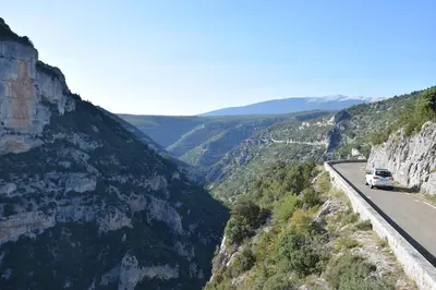 a car driving on a road in the mountains at Moulin des Gypses Gîte l'Oliveraie, Ventoux in Mormoiron