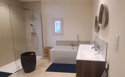 a bathroom with a tub and a sink and a shower at Cycle , Cook and Relax in Caromb