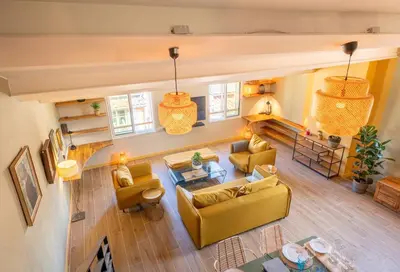 an overhead view of a living room with yellow furniture at Loft COSY et luxueux, HYPER-CENTRE in Aix-en-Provence