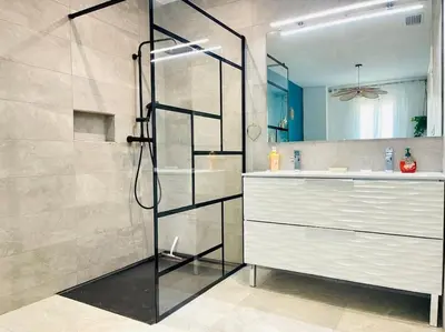a bathroom with a shower with a sink and a counter at Maison haut de gamme dans le golf de pont royal in Mallemort
