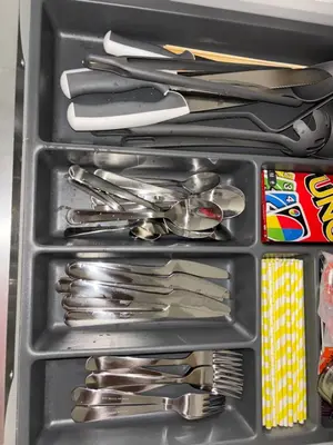 a drawer full of utensils in a refrigerator at Appartement T2 climatisé garage in Aix-en-Provence
