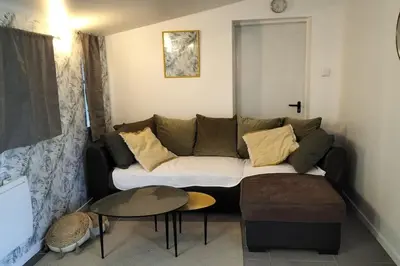 a living room with a couch and a table at le 1387 l'étape en Provence in Plan-dʼOrgon