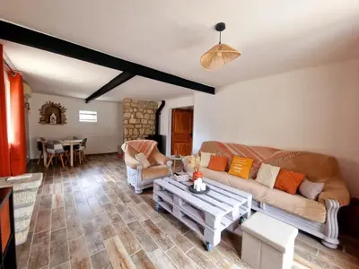 a living room with a couch and a table at Nel Home in Mazan