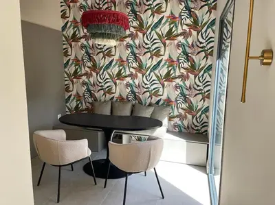 a dining room with a table and two chairs at Bastide Farandole in Eygalières