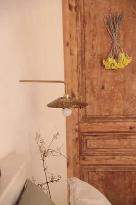 a lamp in a room next to a door at Casa Pauseto in Bonnieux