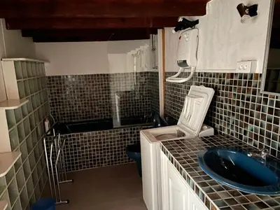 a small bathroom with a sink and a toilet at La Magnanerie in Cabrières-dʼAvignon