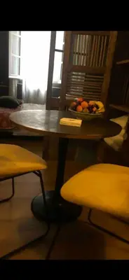 a table and chairs with a bowl of fruit on it at Chambre style balinais in Aix-en-Provence