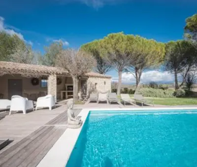 a swimming pool in front of a house at villa avec piscine à Gordes, en Provence in Gordes