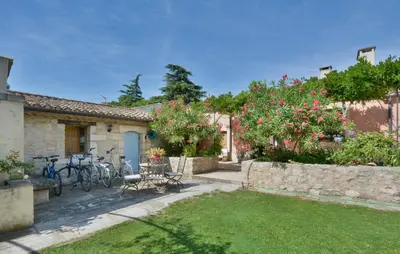 a house with bikes parked in a yard at Stunning Home In Noves With Wifi in Noves