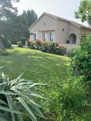 a backyard of a house with a patio at Mas des Lubières in Saint-Rémy-de-Provence
