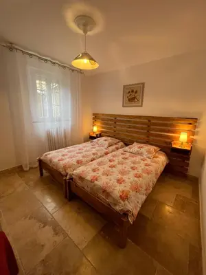 a bathroom with two sinks on a wooden vanity at Mas des Lubières in Saint-Rémy-de-Provence