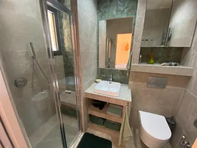 a bathroom with a shower and a sink and a toilet at Studio climatisé - Terrasse, Plancha, Fibre in Aix-en-Provence