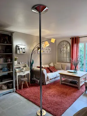 a living room with a couch and a table at Le clos de l’artichaut in Eyguières