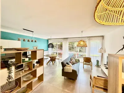 a living room with a couch and a table at Magnifique T2 avec Terrasse in Aix-en-Provence
