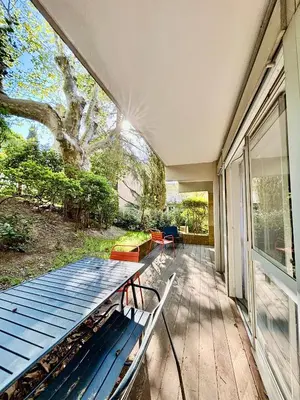 a porch of a house with a bench on it at Magnifique T2 avec Terrasse in Aix-en-Provence