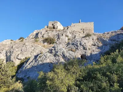 a castle on the top of a mountain at Havre de paix au bord des Alpilles in Eyguières