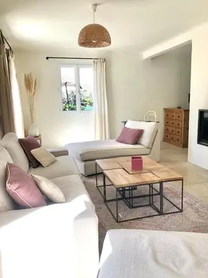 a living room with a table and a couch at Hope, villa à Aix en Provence in Aix-en-Provence
