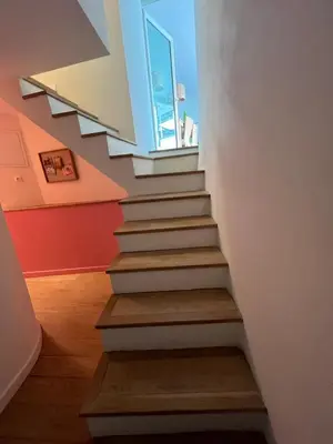 a staircase in a house with a window at Hypercenter lovely duplex with Terrace CLIM WIFI in Aix-en-Provence