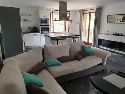an open door to a patio with a table at Appartement dans campagne aixoise in Ventabren