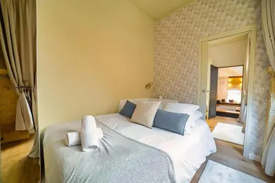 a bedroom with a large white bed in a room at Le Spacieux - Un Voyage en Provence- Offre de lancement in Aix-en-Provence
