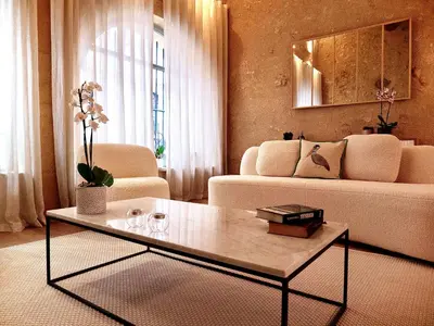 a living room with a couch and a coffee table at Le Spacieux - Un Voyage en Provence- Offre de lancement in Aix-en-Provence