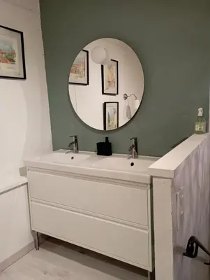 a bathroom with a white sink and a mirror at maisonnette provençale piscine le petit colibri in Les Cordiers