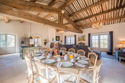 a large dining room with a table and chairs at La Becasse Heritage Pool Manor in Bonnieux