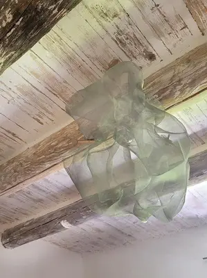 a glass chandelier hanging from a ceiling at Les voûtes du vieux village in Lauris