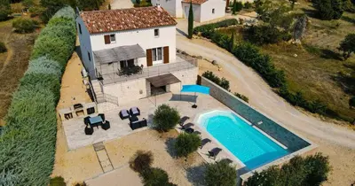 an aerial view of a house with a swimming pool at La Petite Colline in Apt