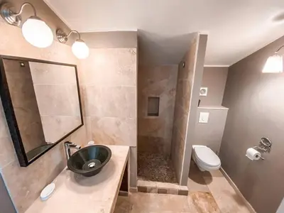 a bathroom with a sink and a toilet at La Petite Colline in Apt