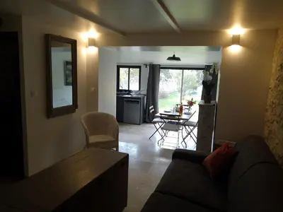 a kitchen with gray counters and a refrigerator at Le Souliadou in Saint-Didier