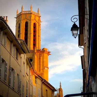 a tall building with a clock tower in the distance at Appartement Vieille ville 55 m2 avec Terrasse 16m2 et 2chambres Vraie Climatisation in Aix-en-Provence
