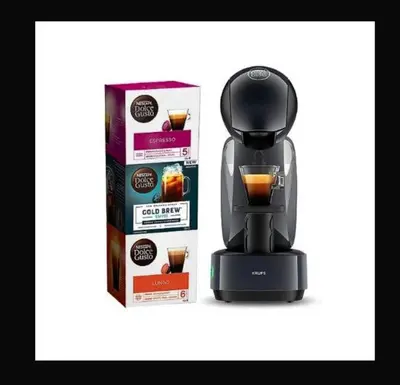 a black coffee maker next to a box of food at Appartement Vieille ville 55 m2 avec Terrasse 16m2 et 2chambres Vraie Climatisation in Aix-en-Provence
