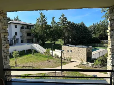 a view of a building from a window at Appartement moderne - Terrasse - Piscine - Parking in Ventabren