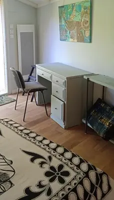 an office with a desk and a chair and a table at La restanque in La Tour-dʼAigues