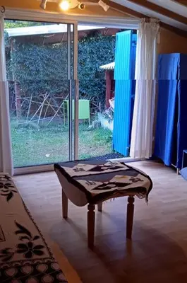 a room with a coffee table in front of a window at La restanque in La Tour-dʼAigues