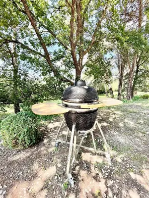 a grill with a surfboard on top of it at Zen et Chic, juste à coté de la Bastide de Marie in Ménerbes