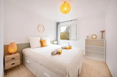 a bedroom with a bed with stuffed animals on it at Ô Cocon Provençal in LʼIsle-sur-la-Sorgue