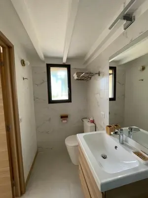 a bathroom with a sink and a toilet and a window at STUDIO campagne Les Clapiers AIX EN PROVENCE in Aix-en-Provence