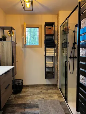 a bathroom with a shower and a towel rack at Chambre d hôtes chez l habitant in Velaux